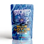 Stoned To Go Blue Lotus Gummies in blueberry flavour by Cannashock, featuring a 6000mg package with psychedelic patterns and a prominent blue lotus flower, emphasizing a refreshing and intense edible experience.