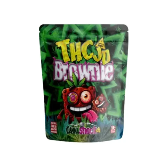 Cannashock THCJD Brownie-Verpackung mit 250 mg THC-JD pro Brownie, die eine verspielte Cartoon-Brownie-Figur vor einem Hintergrund aus grünen Cannabisblättern zeigt und als &quot;süchtig machender Geschmack&quot; bezeichnet wird